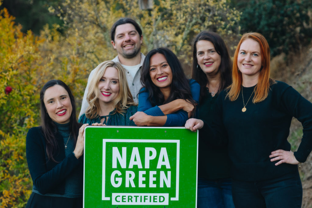 Napa Green Team standing in front of Certified sign